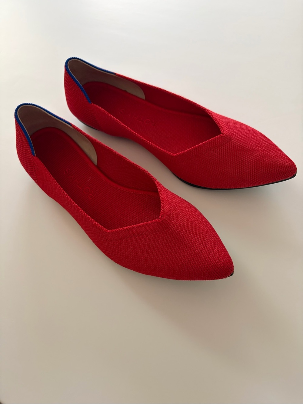 Rothy’s vibrant red ballet slip on flats